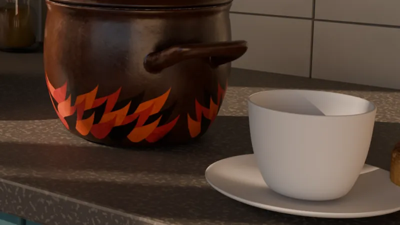 The cup standing on its saucer on the worktop